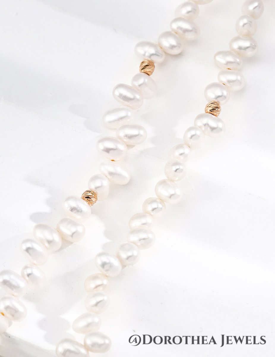 Delicate Rice Pearl Station Necklace with Gold Bead Accents - DOROTHEA JEWELS