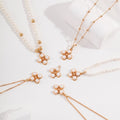Four - Petal Natural Pearl Flower Charm in S925 Silver - DOROTHEA JEWELS