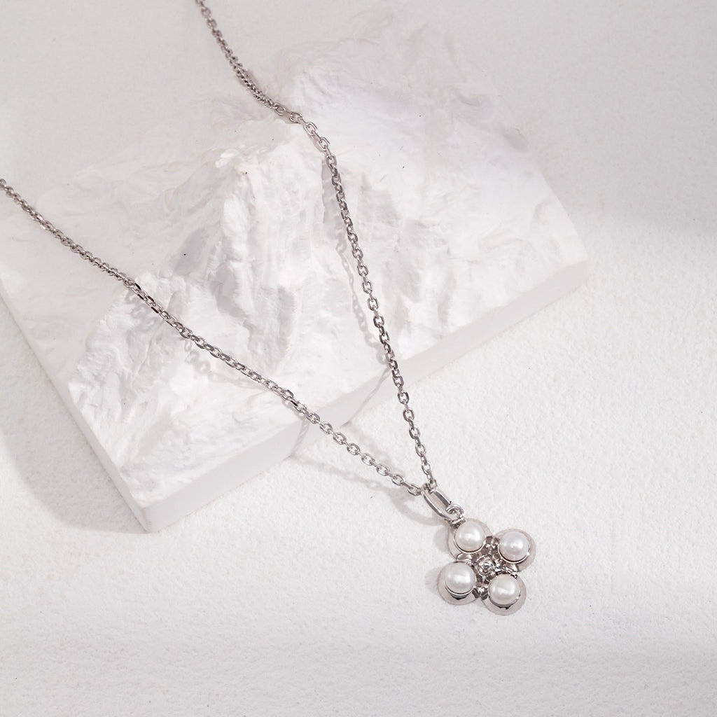 Four - Petal Natural Pearl Flower Charm in S925 Silver - DOROTHEA JEWELS