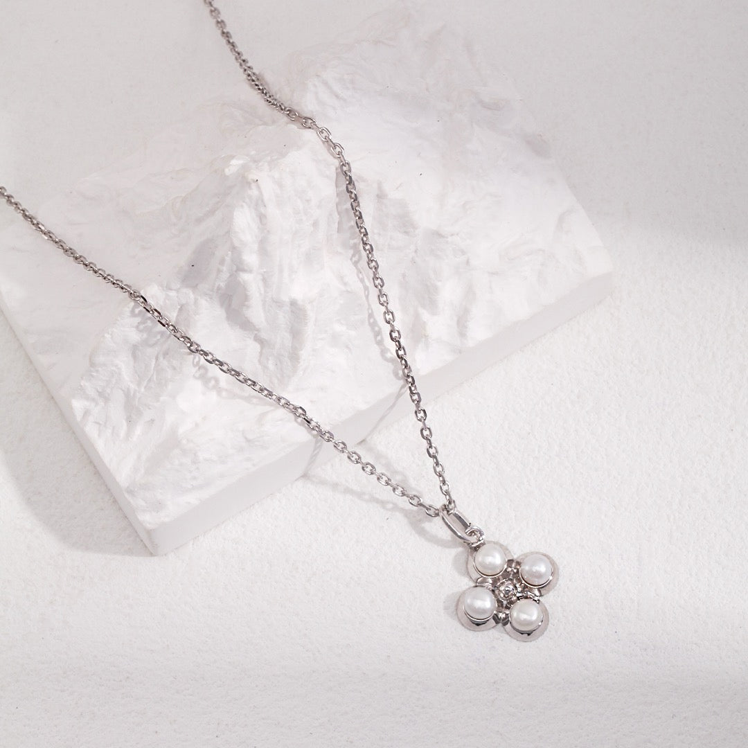 Four - Petal Natural Pearl Flower Charm in S925 Silver - DOROTHEA JEWELS